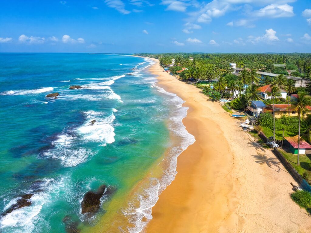 Aerial view of a golden beach on the south coast of Sri Lanka